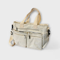 Maria. - Mala com vários bolsos